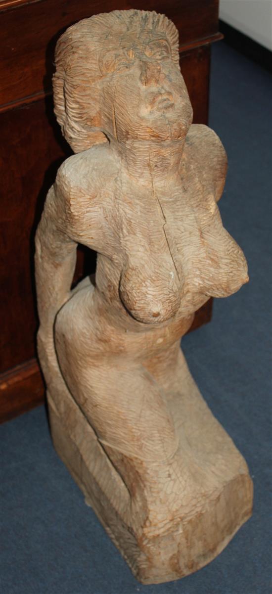 Cyril Saunders Spackman (1887-1963). A 20th century wood carving of a kneeling nude woman, 31.5in.